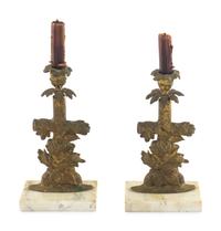 A Pair of Gilt Metal Candlesticks