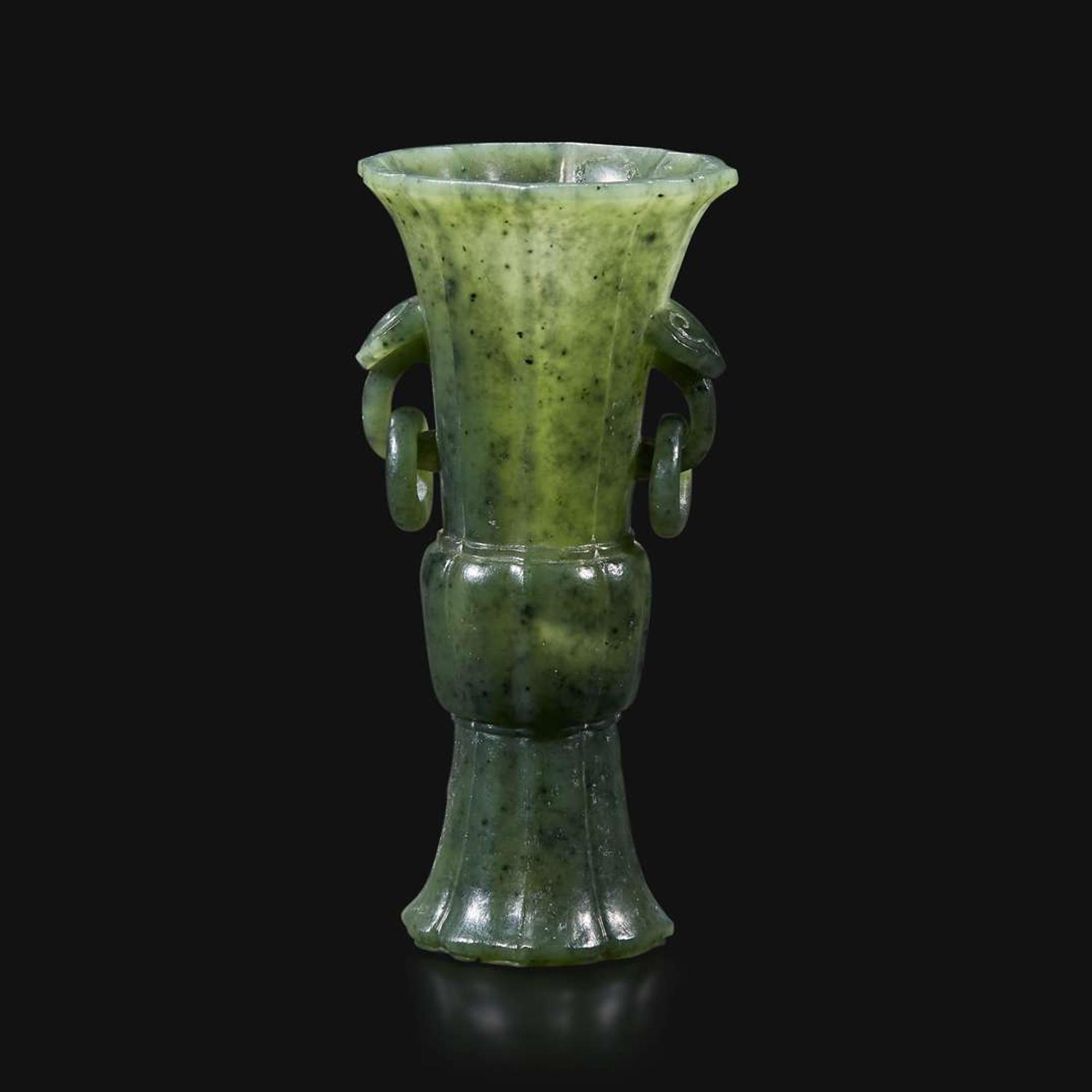A small Chinese carved spinach green jade lobed gu-form vase