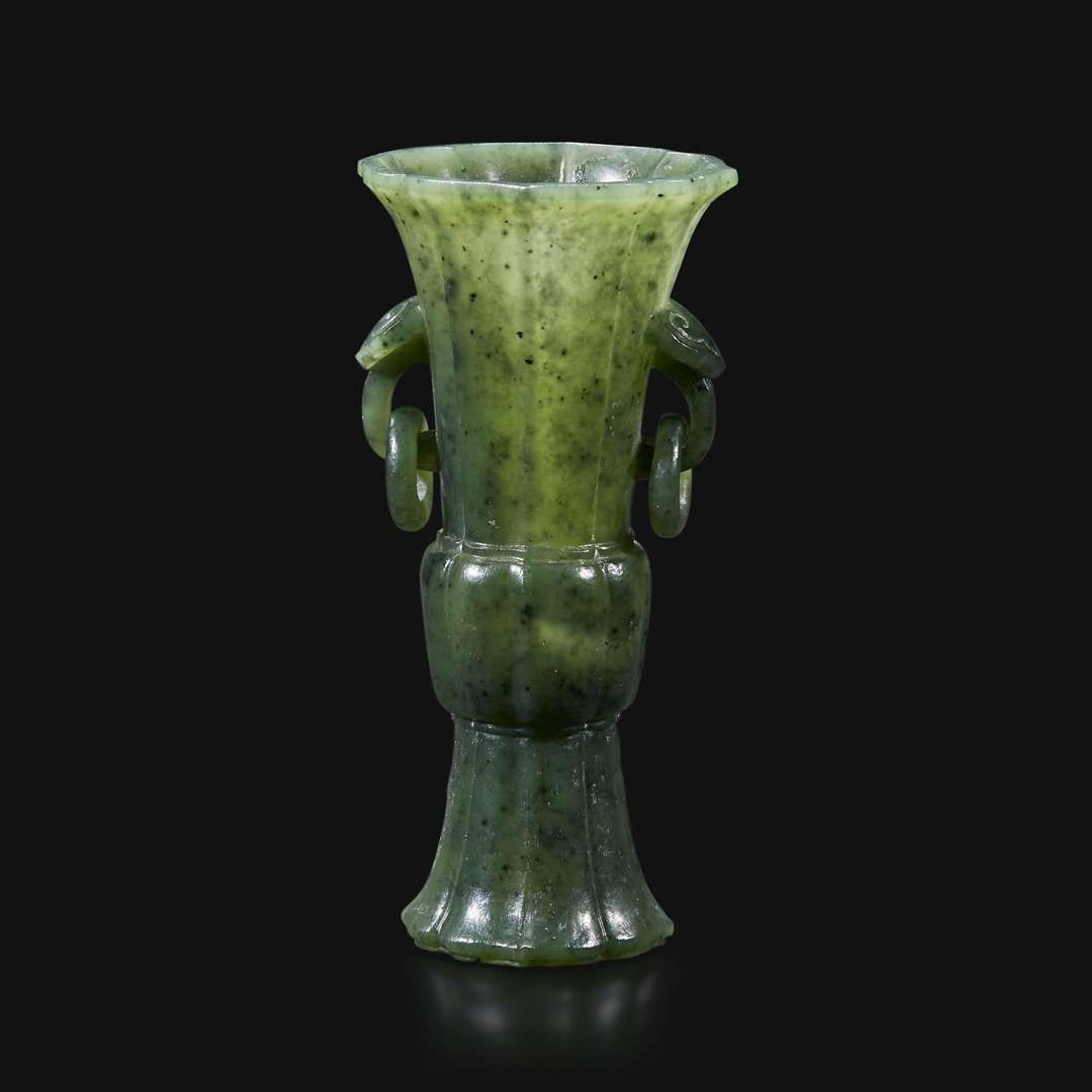 A small Chinese carved spinach green jade lobed gu-form vase