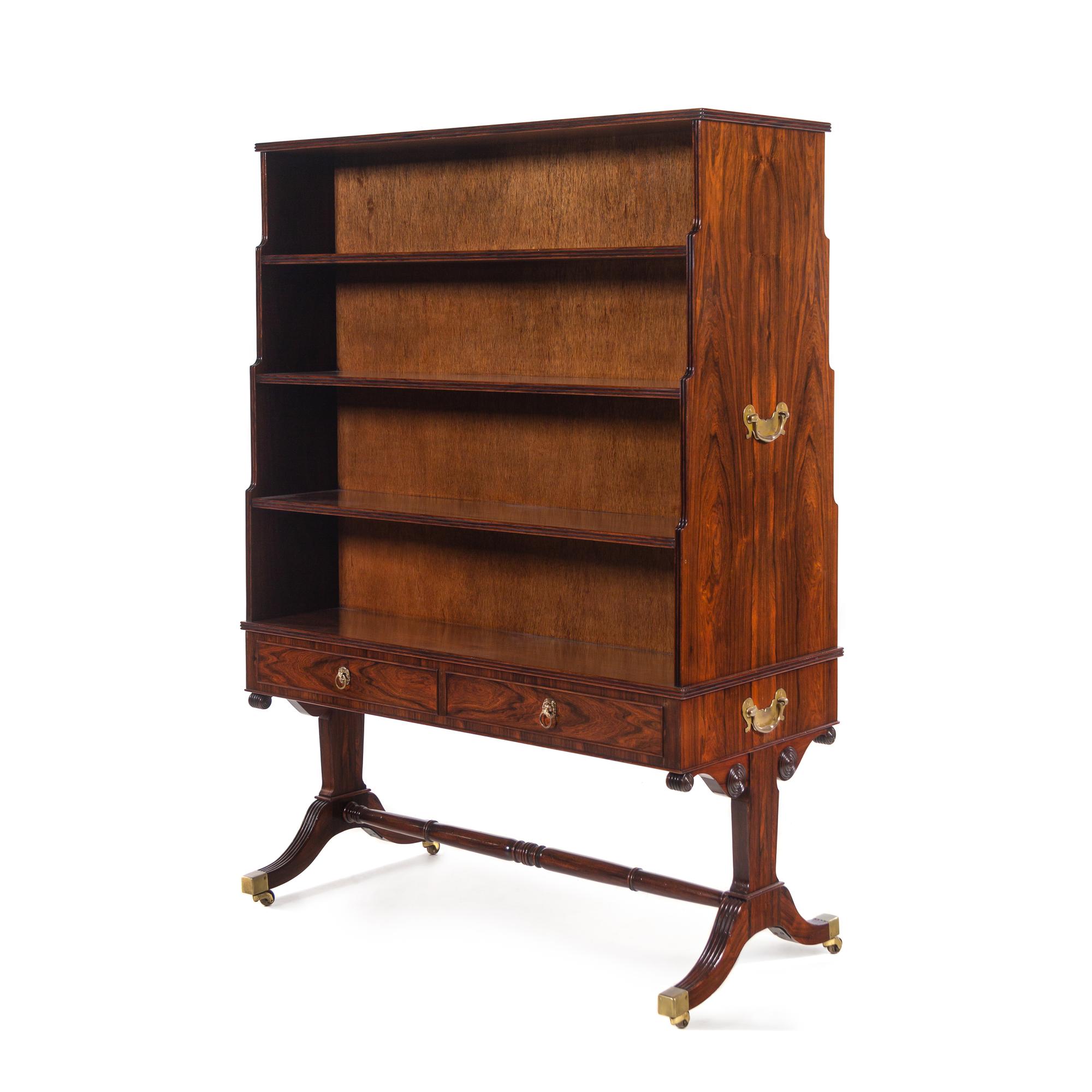 A Regency Style Figured Rosewood Double-Sided Bookcase on Stand