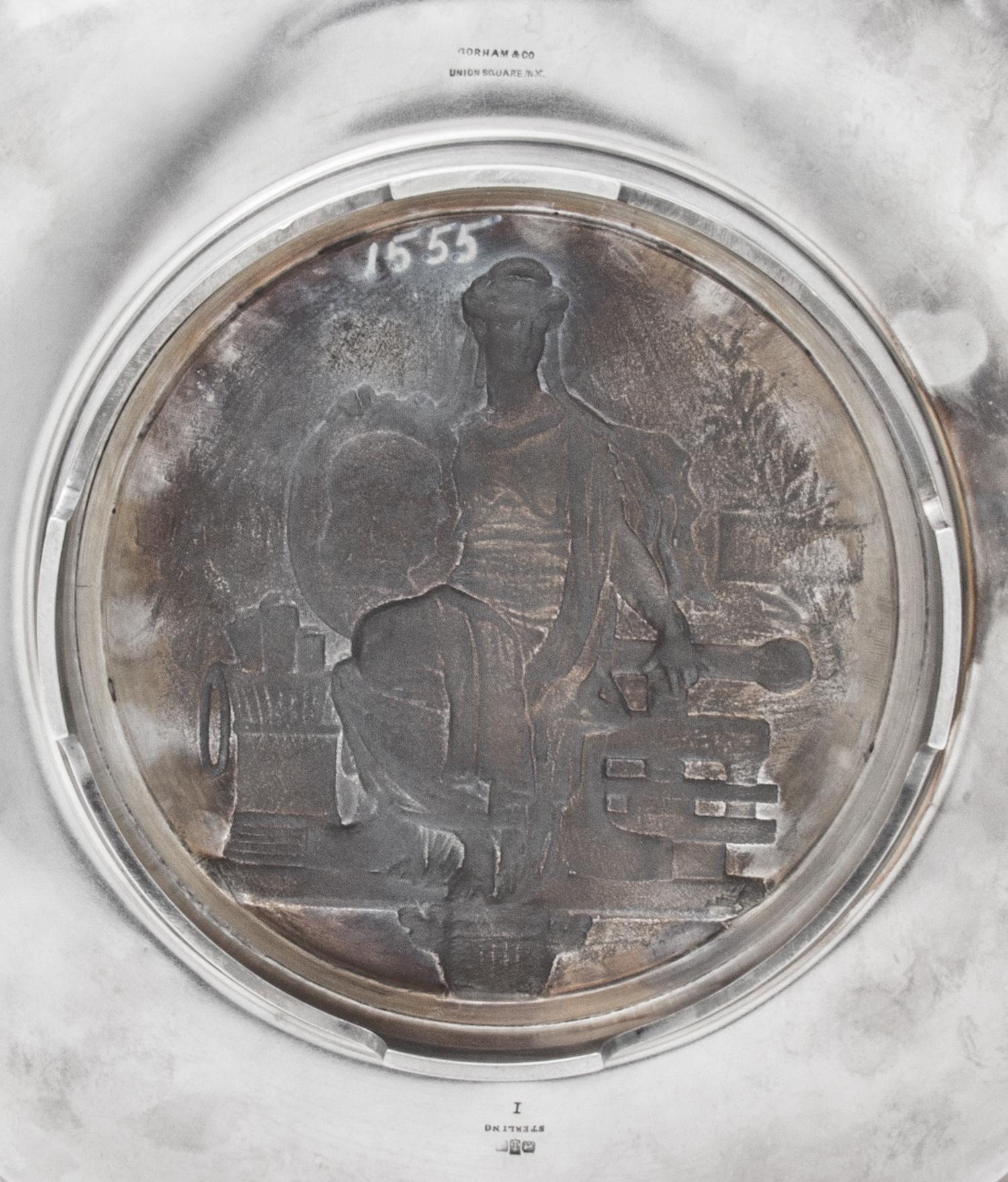 An American Silver Commemorative Dish, Gorham Mfg. Co., Providence, RI, 1876, the twin-handled circular dish centered with a medallion