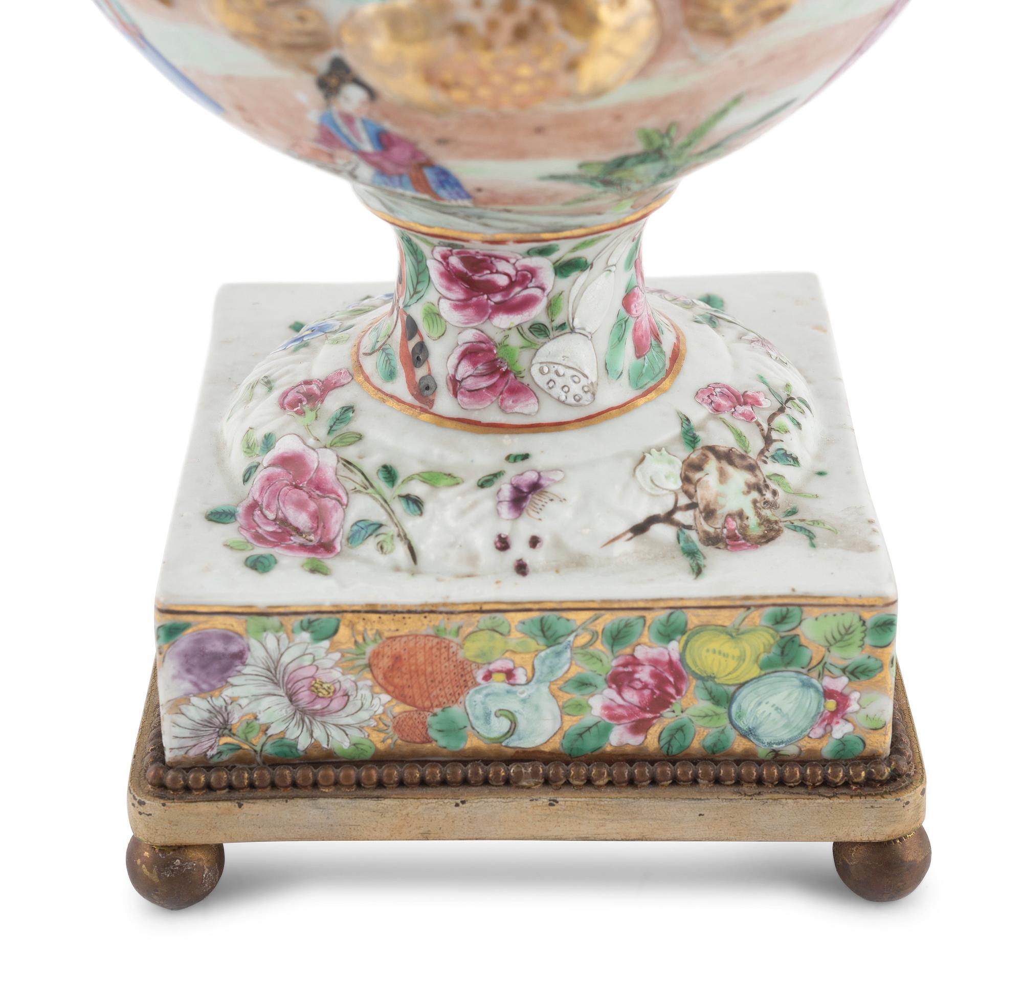 A Chinese Export Parcel Gilt Decorated Famille Rose Porcelain Pistol-Handled Urn