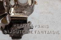 Two Hermès Items: Pair of Ear Clips and Ring