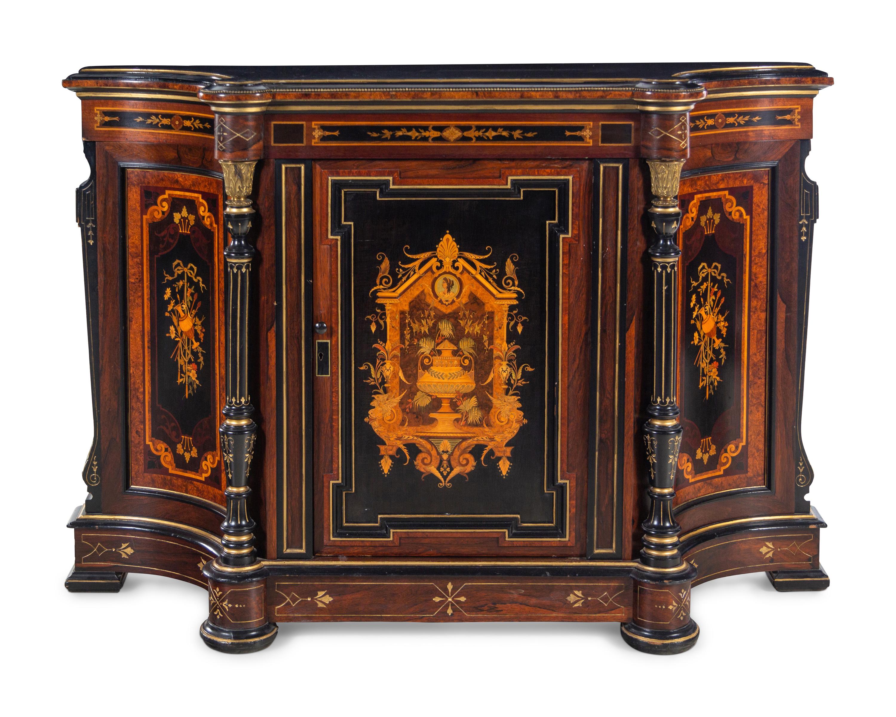 A Victorian Parcel Gilt Ebonized and Inlaid Rosewood Parlor Cabinet
