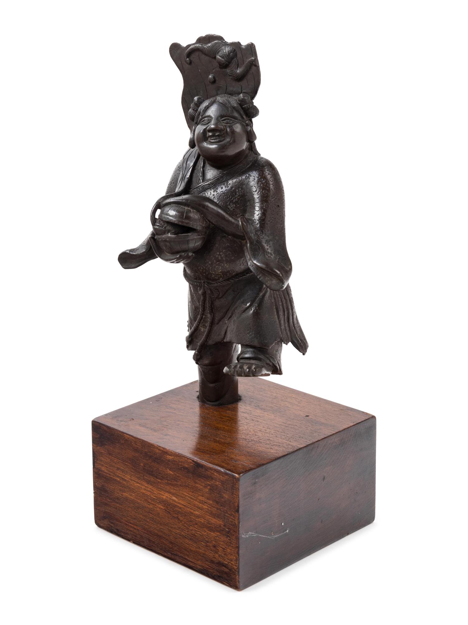 A Chinese Bronze Figure of a Boy Immortal