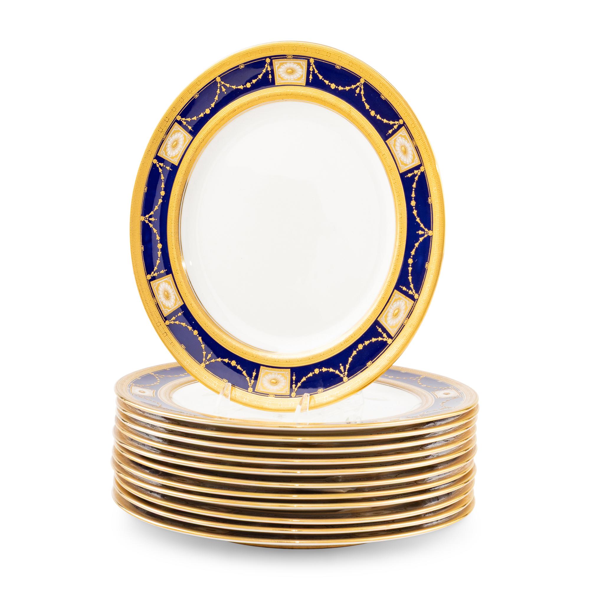 A Set of Twelve Royal Doulton Parcel Gilt Porcelain Dinner Plates