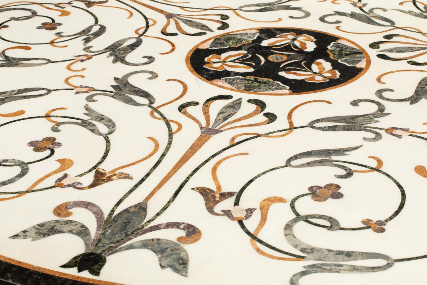 An Italian Parcel-Gilt and Ebonized Pietra Dura-Top Center Table