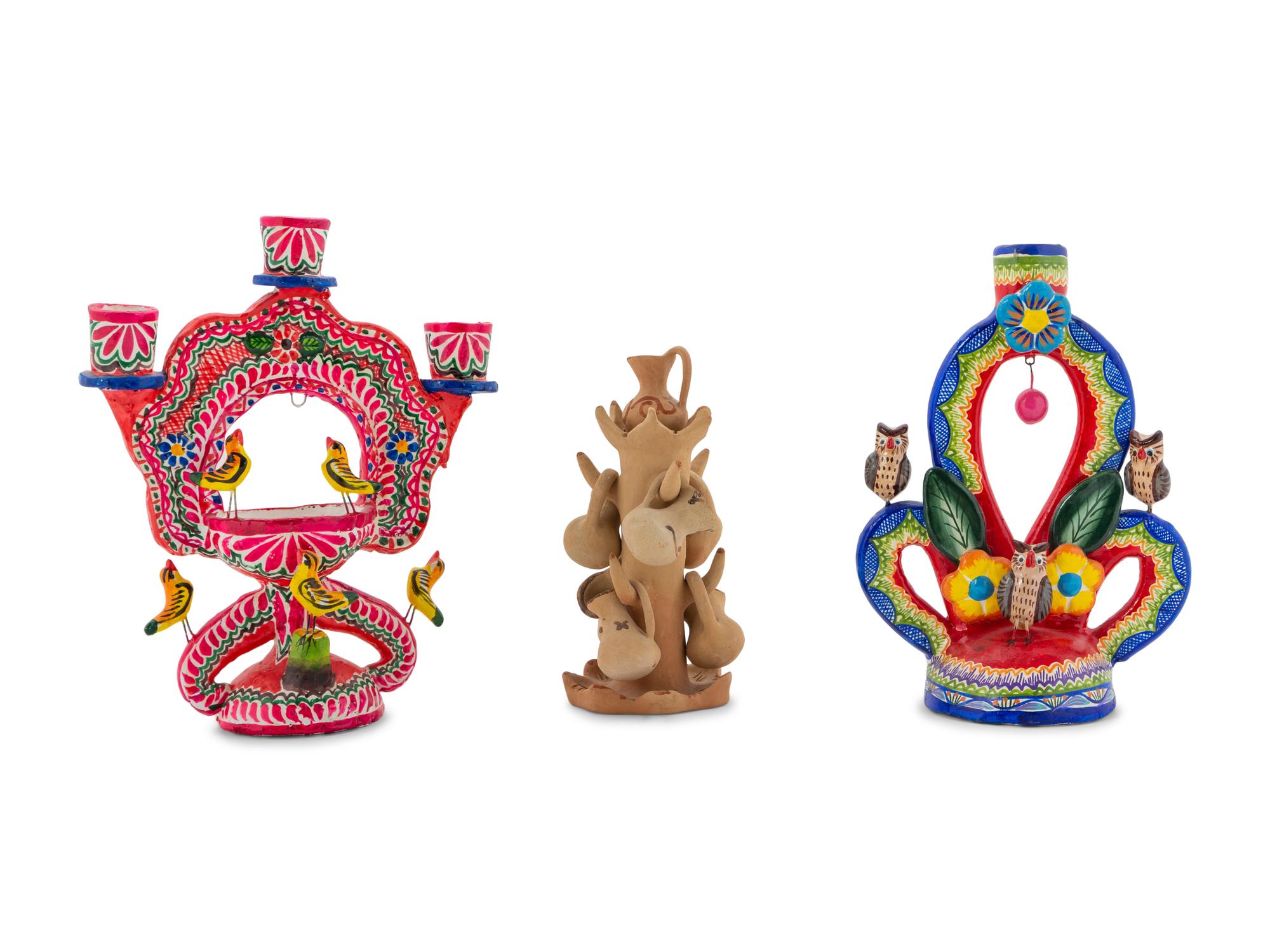 A Collection of Mexican Pottery Candelabra
