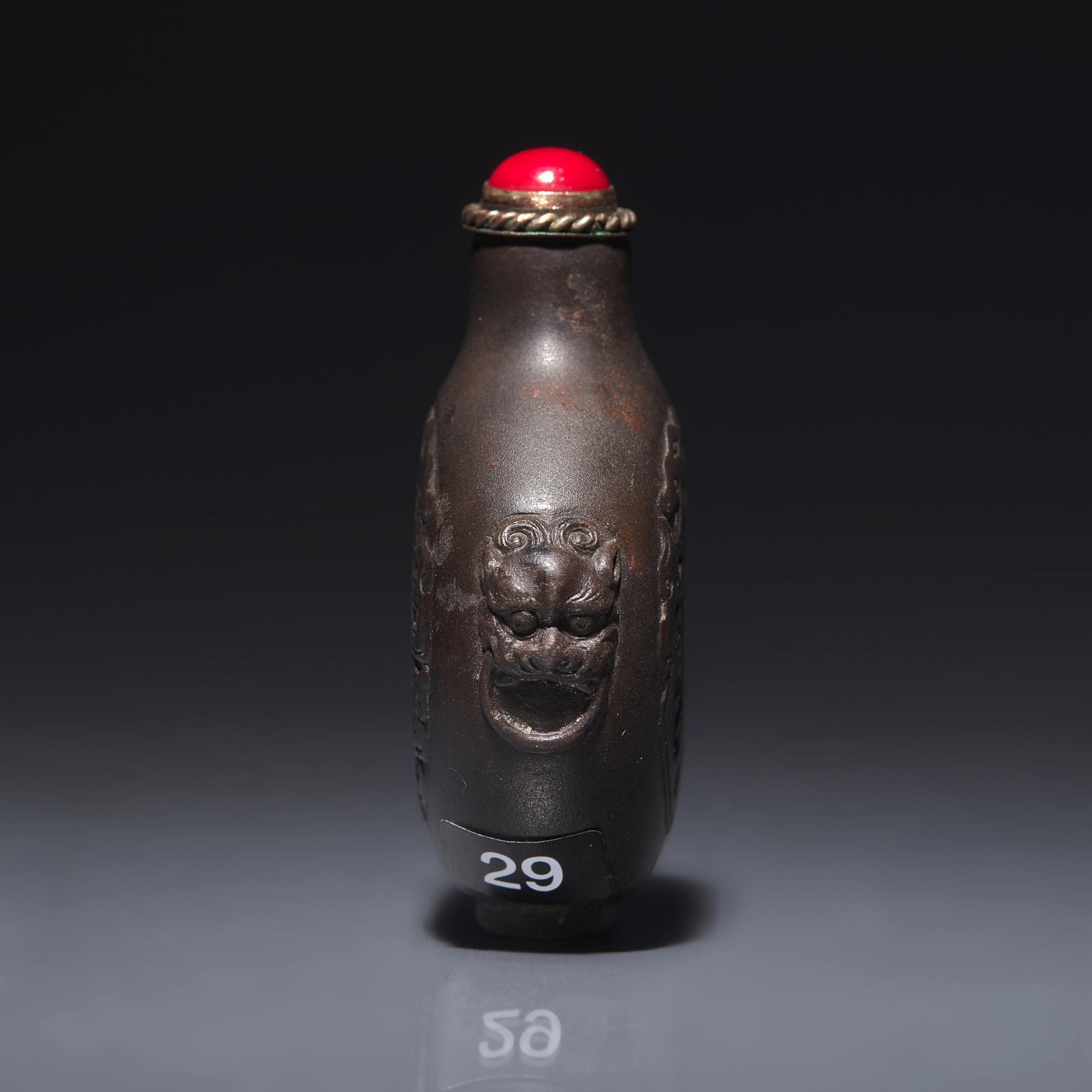 A Chinese Carved Duan Stone Snuff Bottle, Circa 1750-1820 1750-1820年 端石刻龍紋鼻烟壺