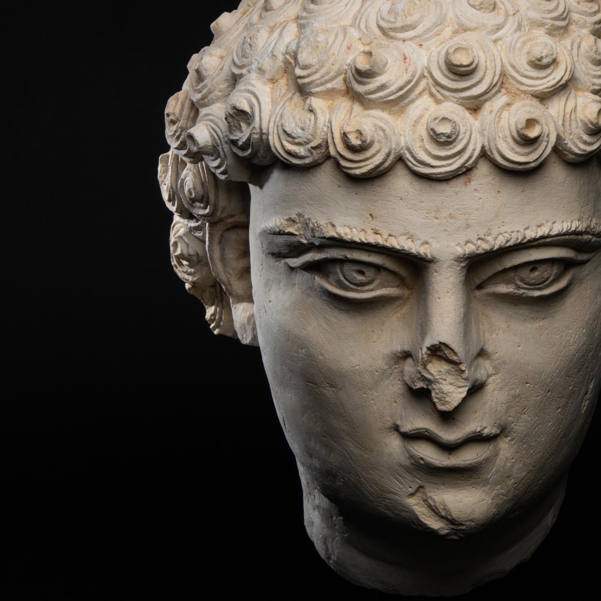 A Palmyrene Limestone Head of a Youth