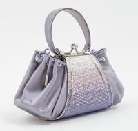 A Judith Leiber Purple Satin and Crystal Handbag, 8" x 4" x 3".