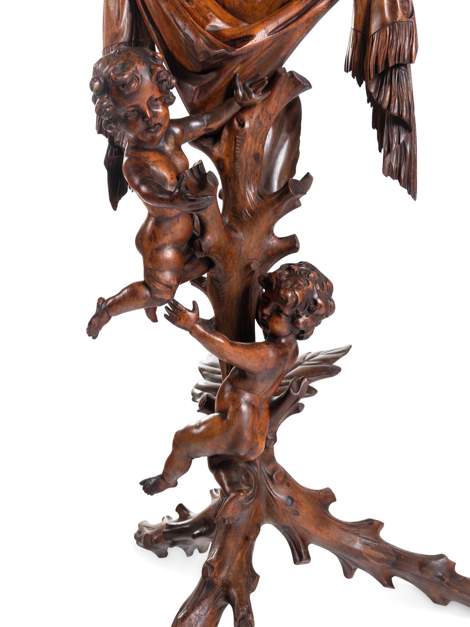 A Venetian Carved Walnut Figural Pedestal