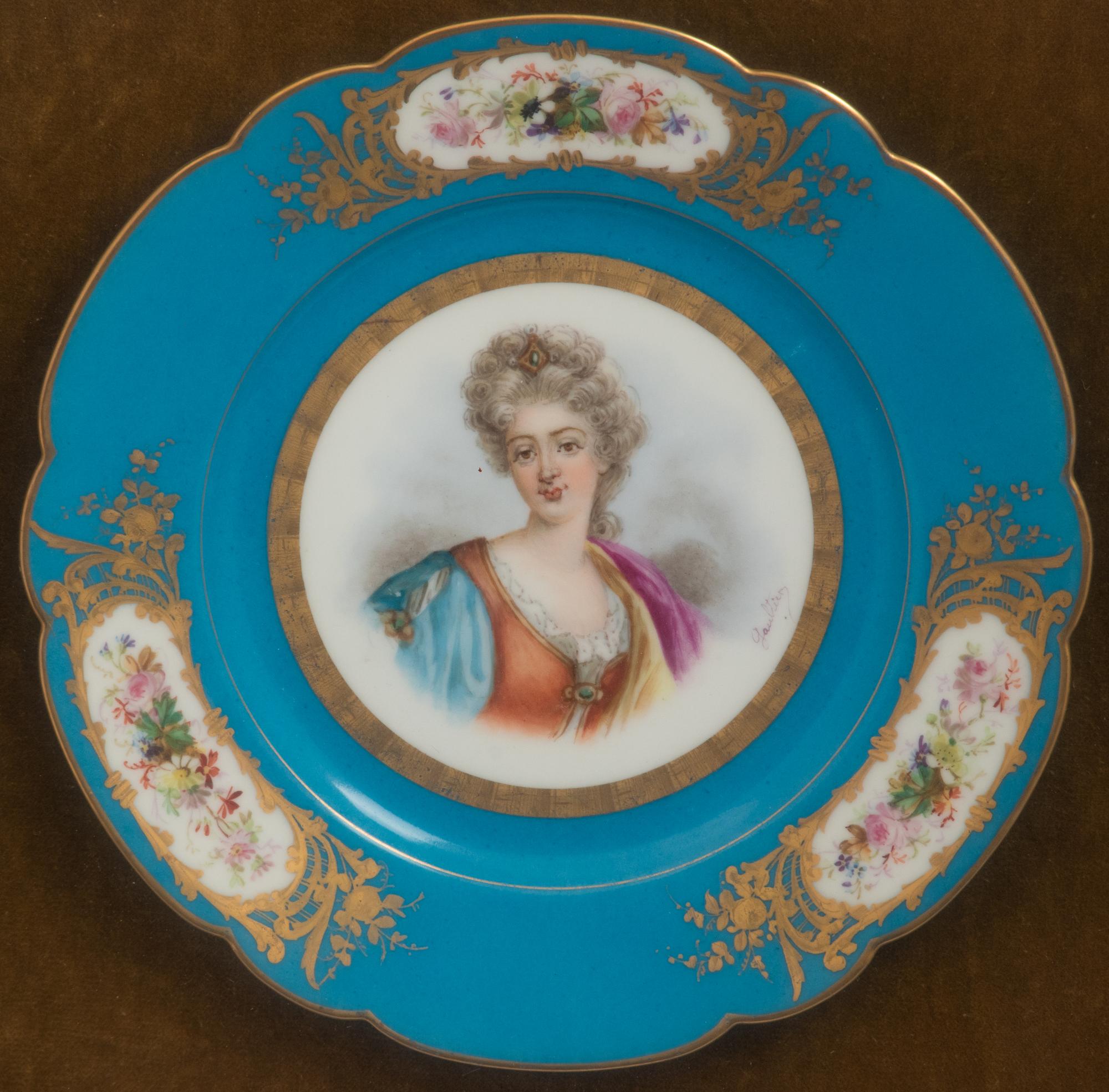A Group of Seven Framed Sèvres Style Porcelain Plates