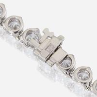 A diamond and fourteen karat white gold rivière necklace