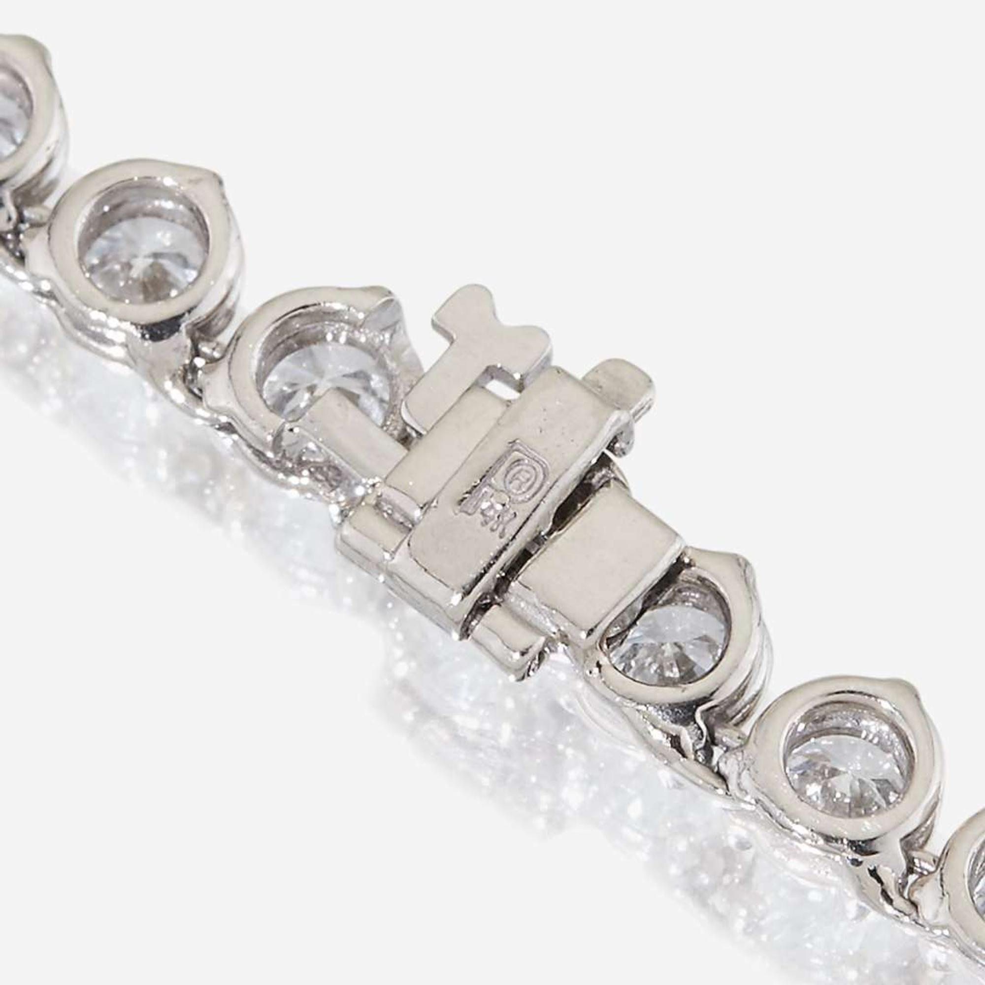A diamond and fourteen karat white gold rivière necklace