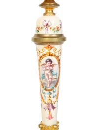 A Pair of French Gilt Bronze and Painted Porcelain Candlesticks