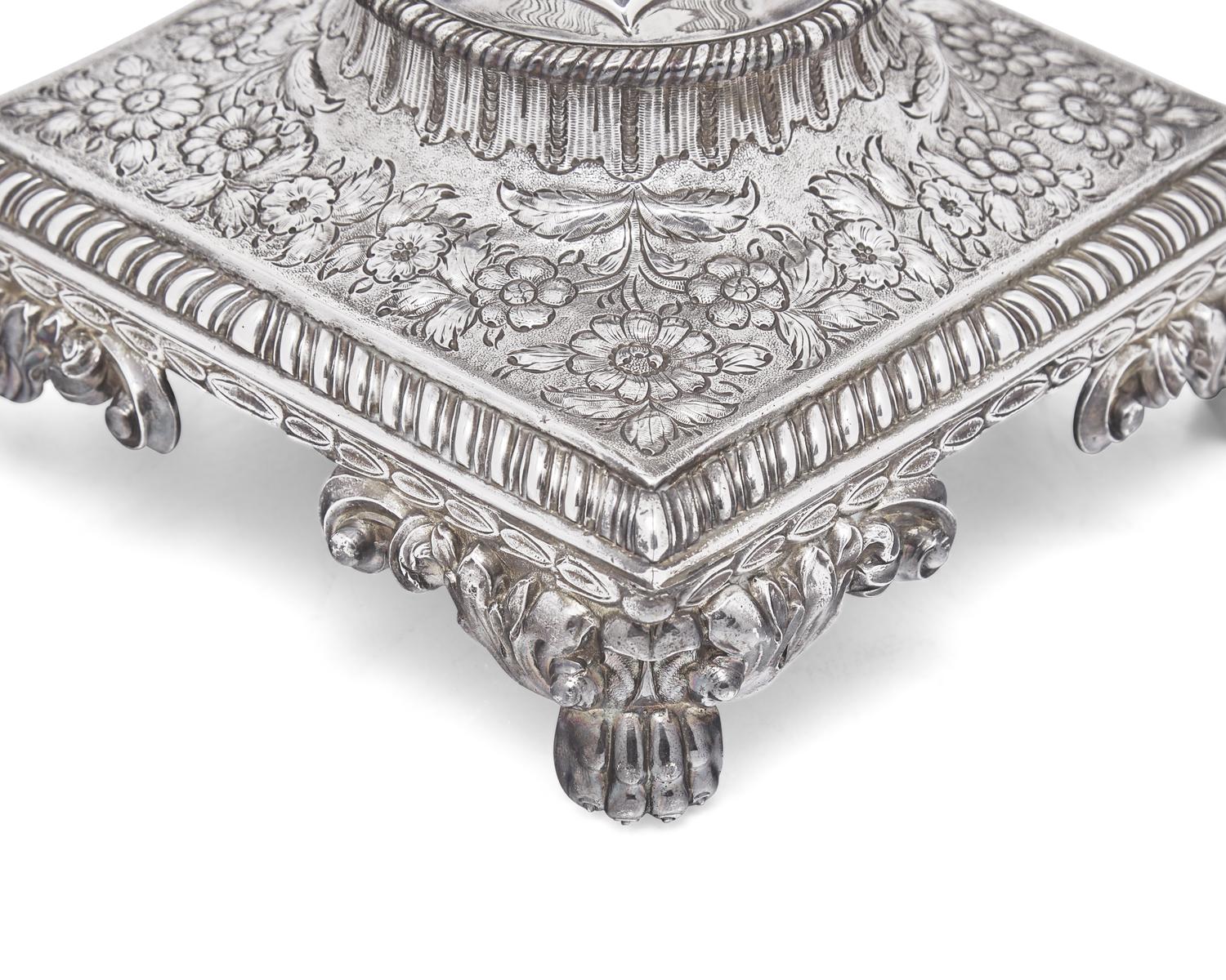 A George III sterling silver floral repoussé hot water urn, maker's mark rubbed, London, 1766