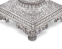 A George III sterling silver floral repoussé hot water urn, maker's mark rubbed, London, 1766