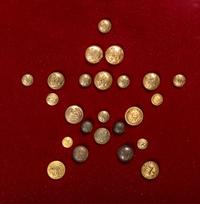 A collection of 24 Civil War buttons representing every branch of the Union Army displayed in decorative frame.
