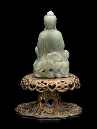 A Chinese Celadon Jade Figure of Seated Guanyin