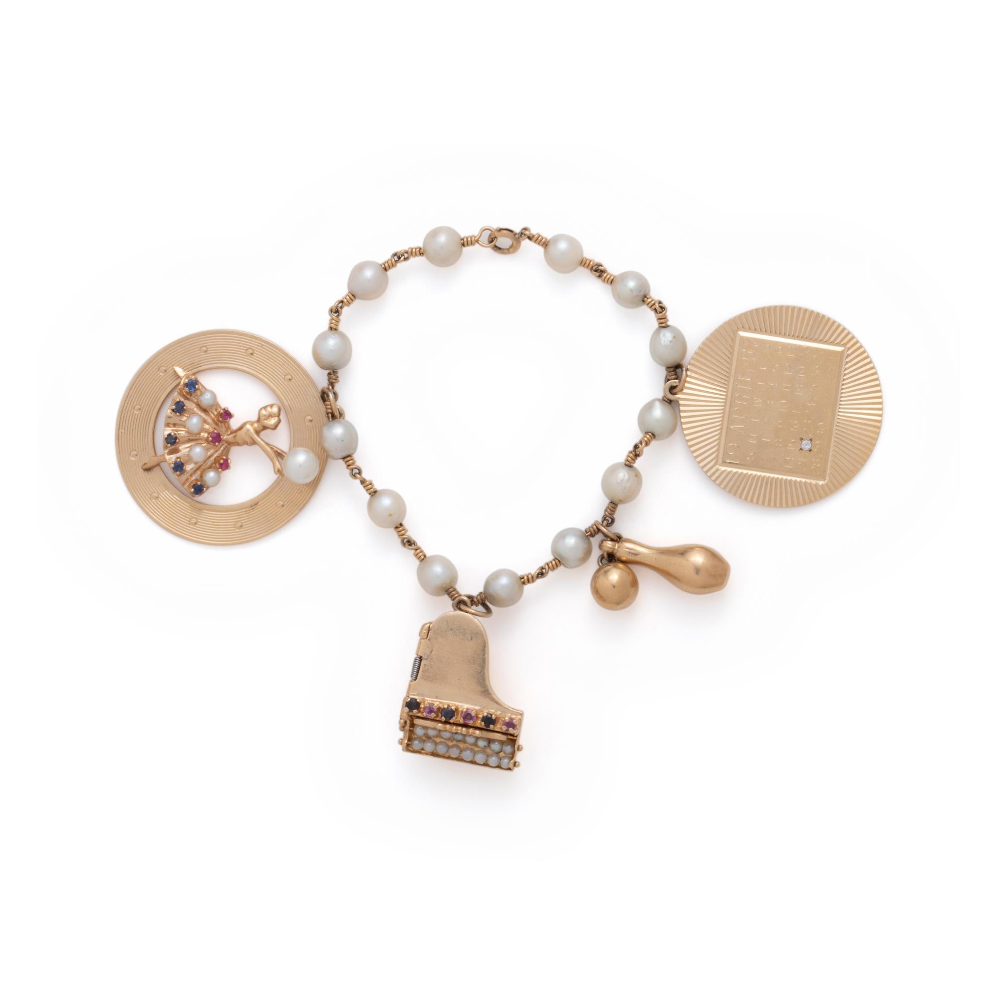 YELLOW GOLD AND CULTURED PEARL CHARM BRACELET