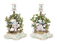 A Pair of Meissen Porcelain Figural Candlesticks with Floral Arbors