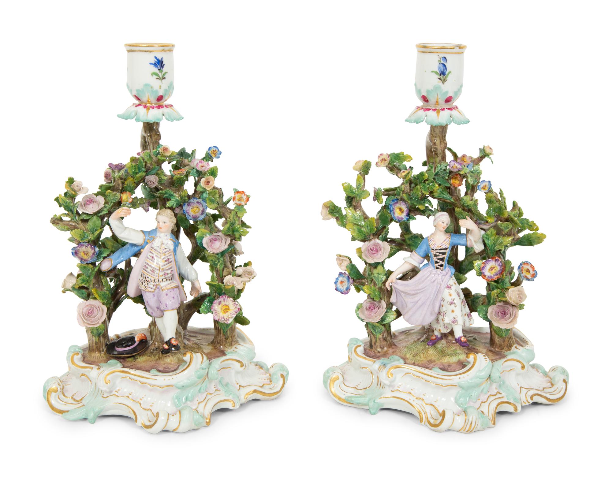 A Pair of Meissen Porcelain Figural Candlesticks with Floral Arbors