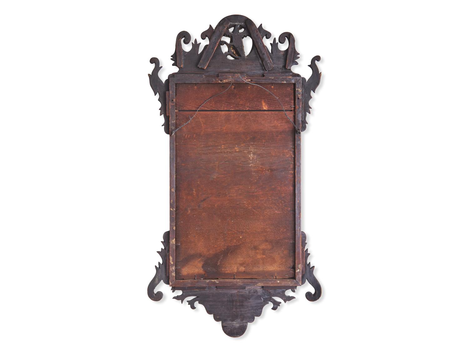 A Chippendale Fret-Carved and Parcel-Gilt Mahogany Looking Glass