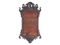 A Chippendale Fret-Carved and Parcel-Gilt Mahogany Looking Glass