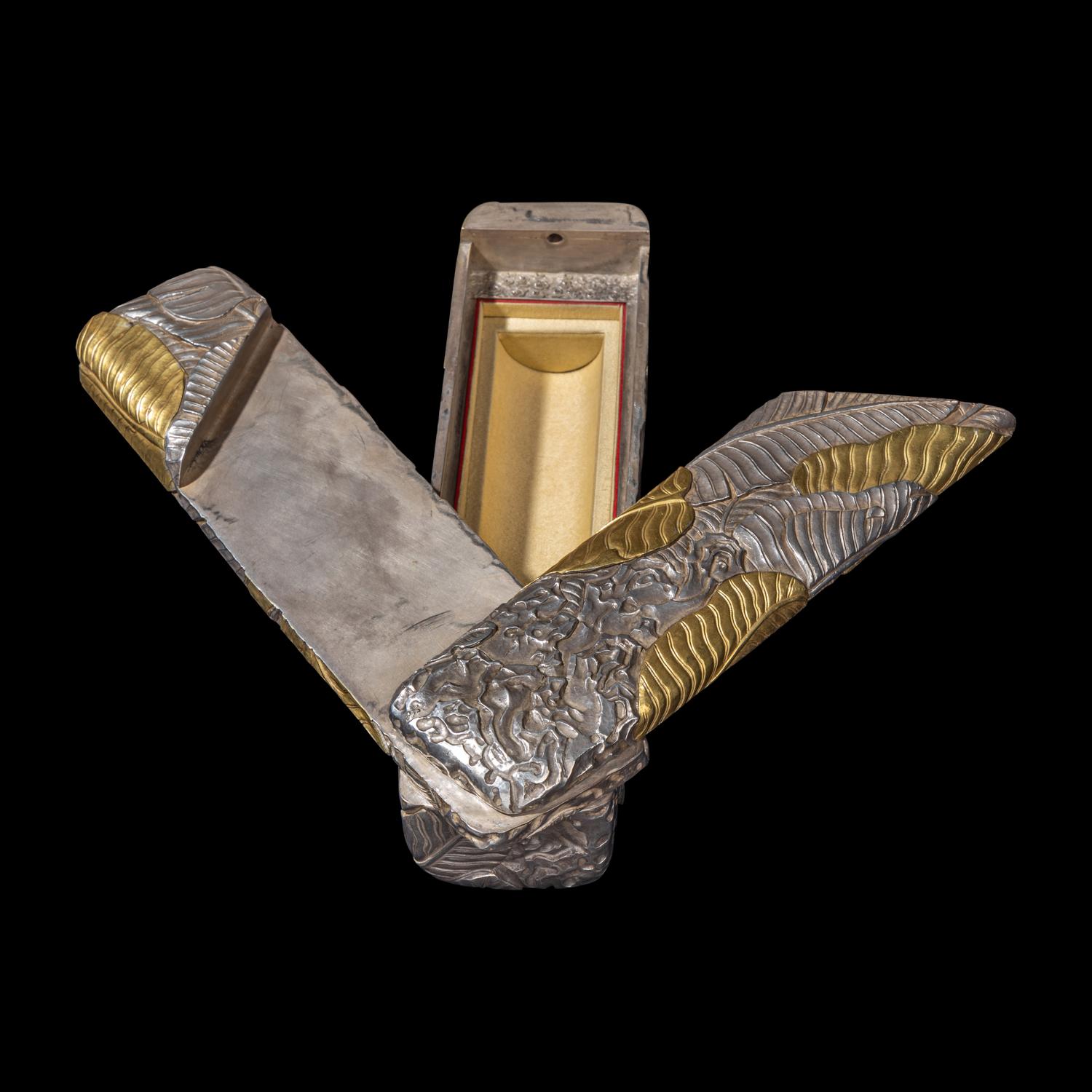 A Chinese Parcel-Gilt Silver Repoussé 'Plantain Leaves' Rectangular Scroll Box, Incised Qianlong Mark 清乾隆乙卯（1796）銀鎏金鏨蕉葉紋手卷機關盒