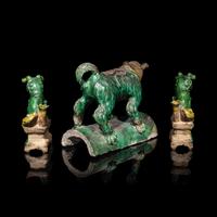 A Chinese Sancai Glazed ' Lion' Roof Tile and a Pair of Figures of Lions, Ming Dynasty 明 素三彩佛獅瓦當及佛獅像一對