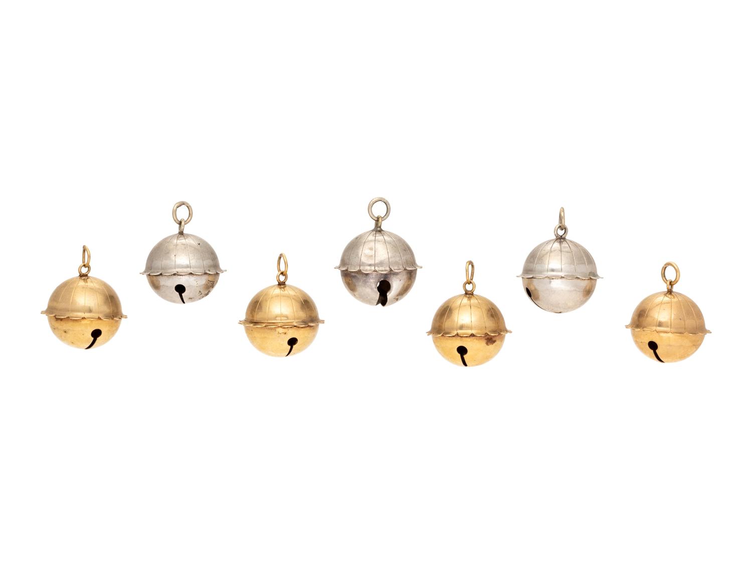 A Collection of 14 Karat Yellow Gold and Sterling Silver Jingle Bells,