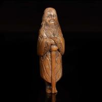 A Chinese carved brown and grey soapstone "Sennin" netsuke 中國壽山石“仙人”根付 18th/ early 19th century ????????