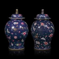 A Pair of Chinese Enameled Blue-Ground Porcelain Jars and Covers, First Half 19th Century — 清中期 藍地粉彩蝶戀花紋將軍罐一對