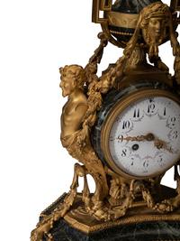 A Napoleon III Gilt Bronze and Marble Clock