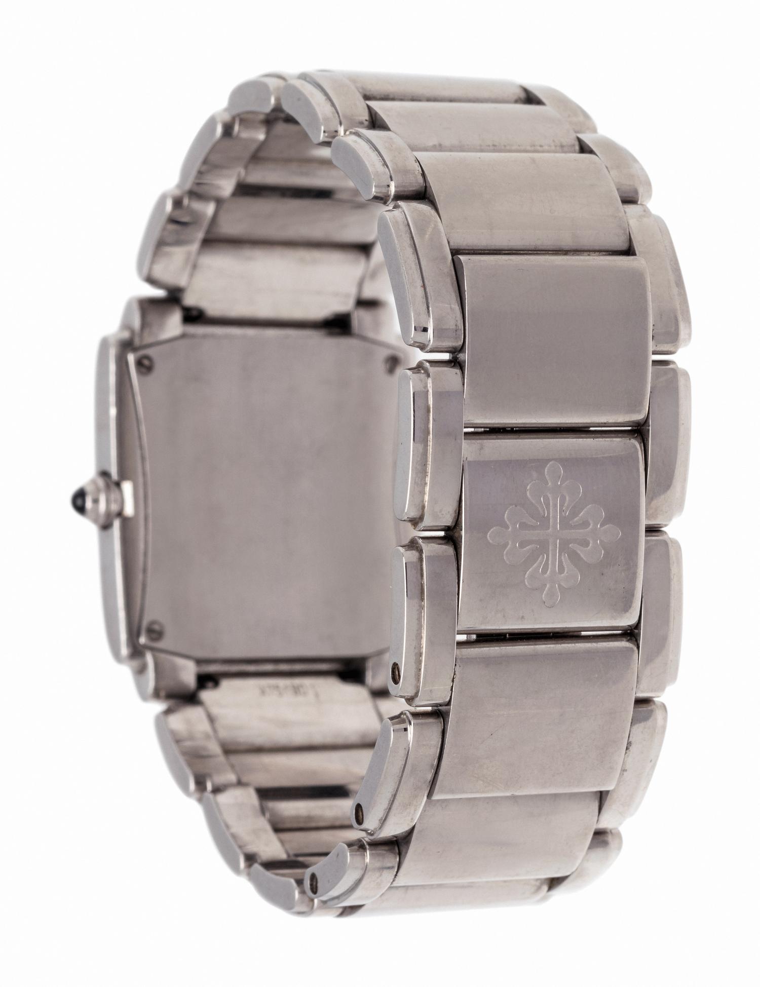 PATEK PHILIPPE, STAINLESS STEEL AND DIAMOND REF. 4910/010 'TWENTY-4' WRISTWATCH