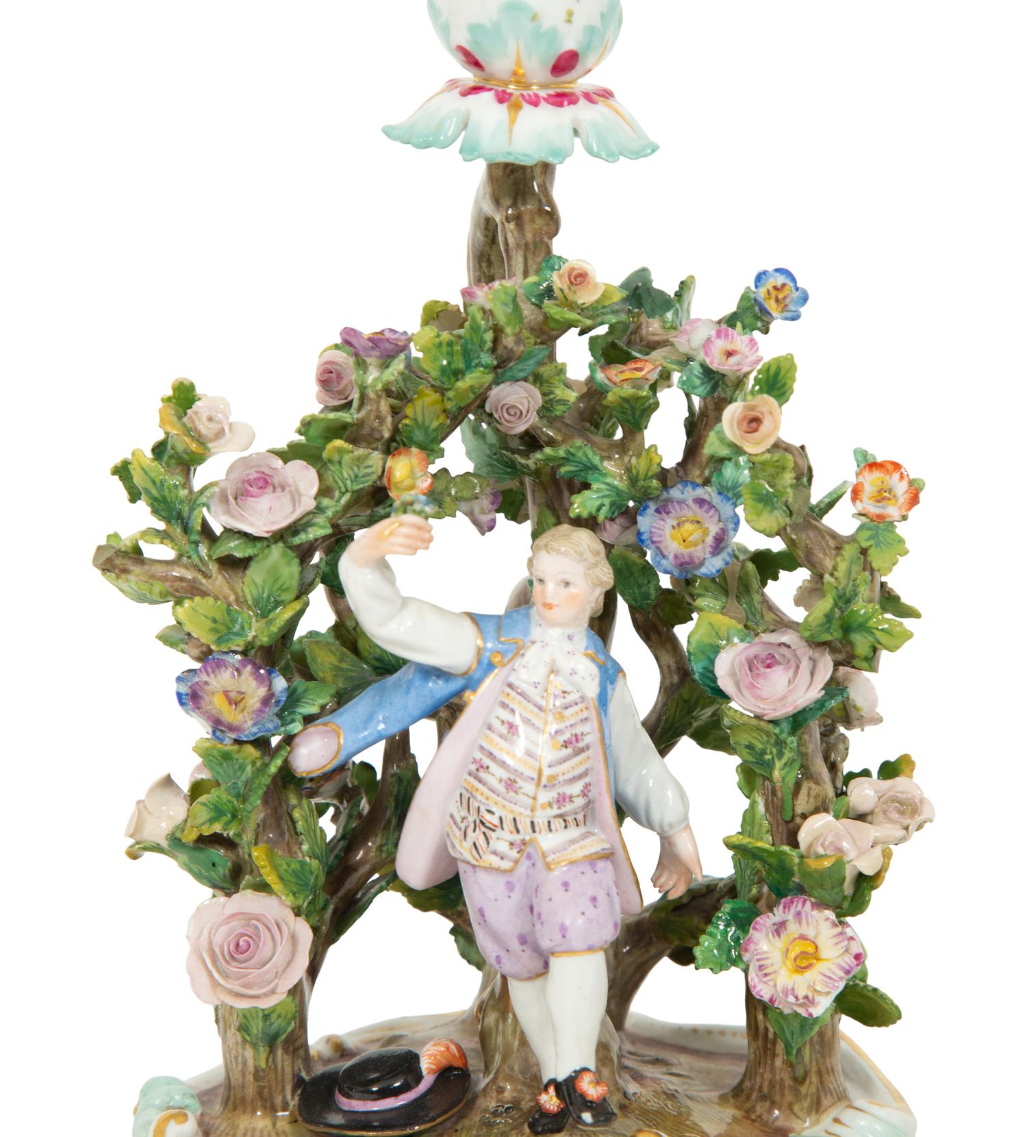 A Pair of Meissen Porcelain Figural Candlesticks with Floral Arbors