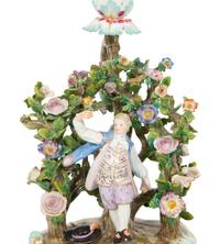 A Pair of Meissen Porcelain Figural Candlesticks with Floral Arbors