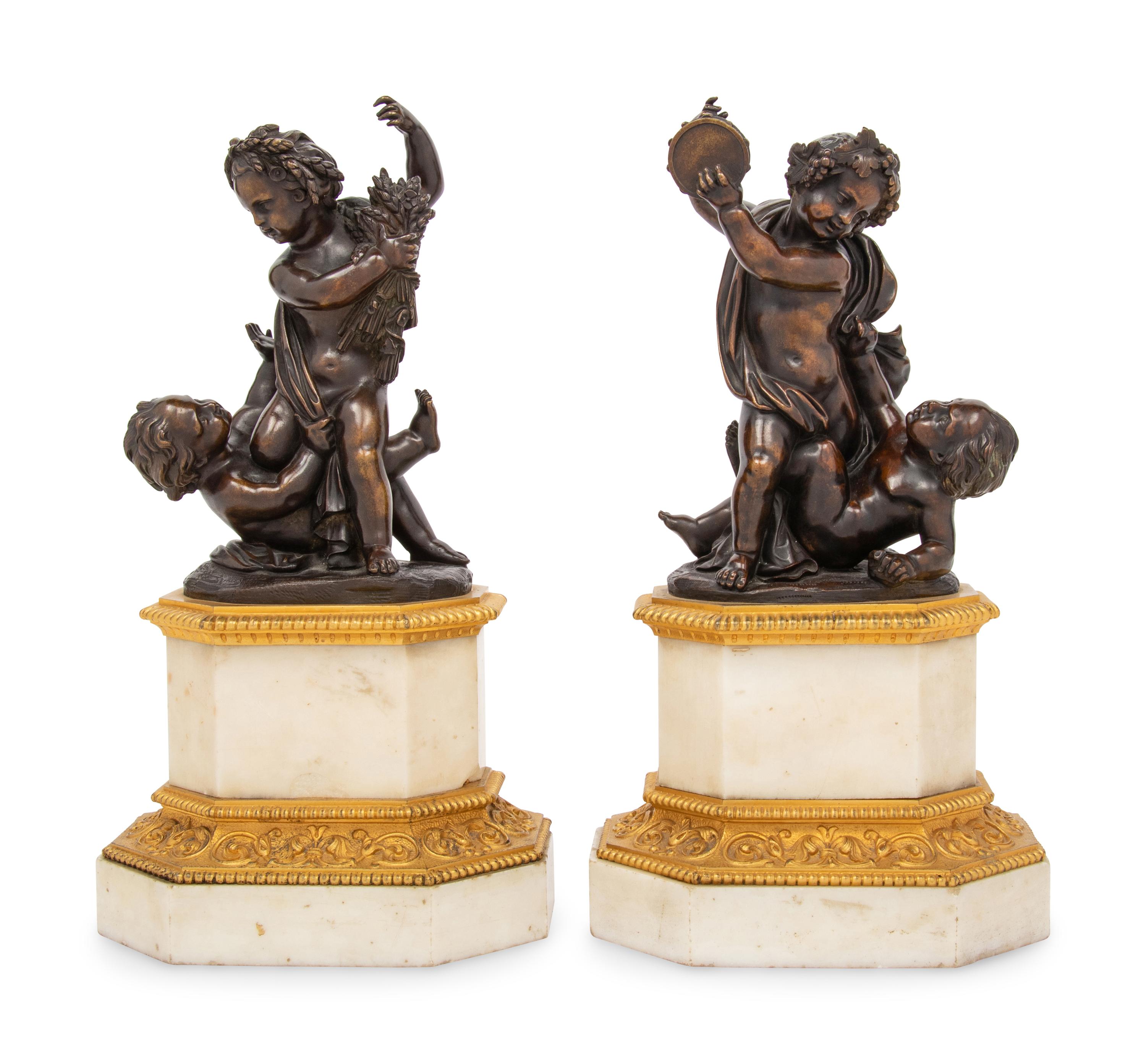 A Pair of French Gilt and Patinated Bronze and Marble Ornaments