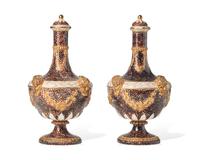 A Pair of Wedgwood Parcel Gilt and Mottled Glazed Lidded Barber’s Bottles