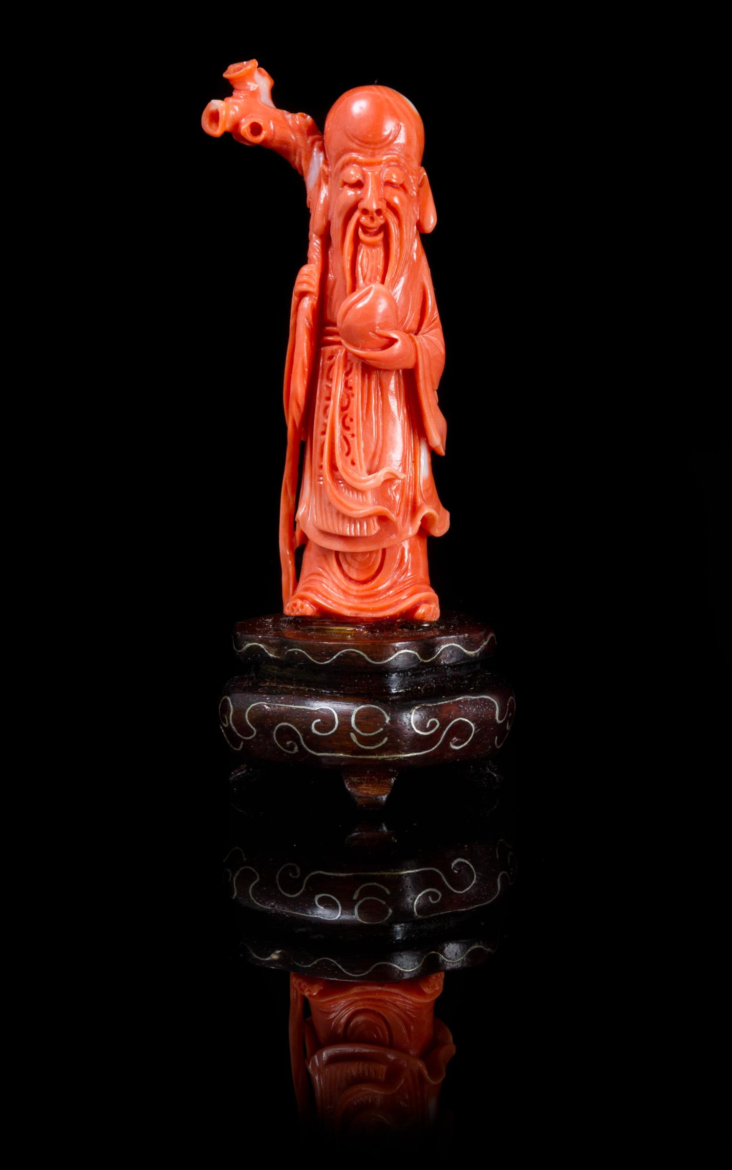 A Carved Coral Figure of Shoulao Height overall 3 5/8 inches.