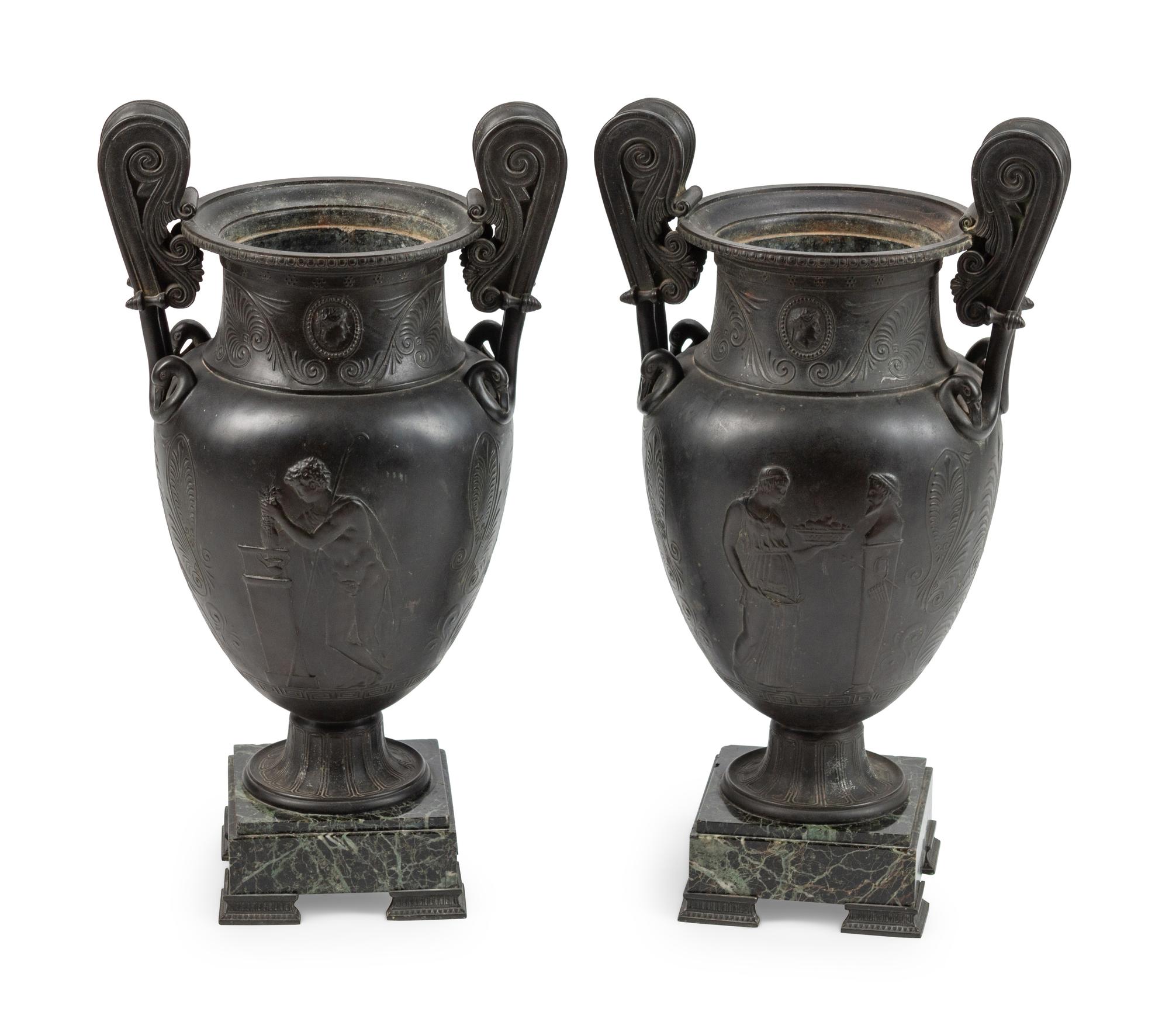 A Pair of Grand Tour Patinated Metal Urns on Marble Bases
