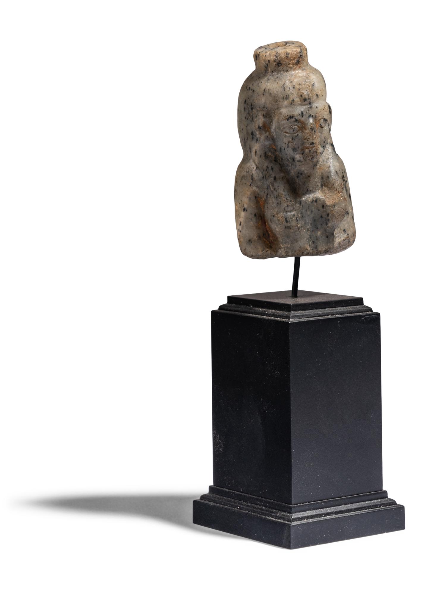 An Egyptian Stone Bust of Hathor