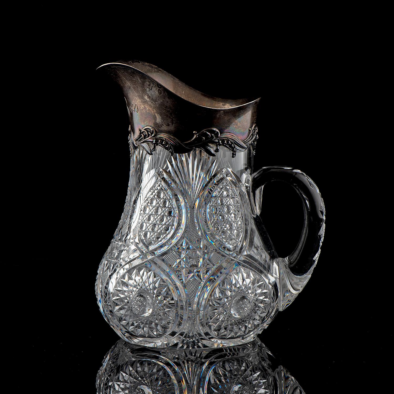 A Brilliant-Period Cut Glass Water Pitcher with Lilies of the Valley and a Silver Mount