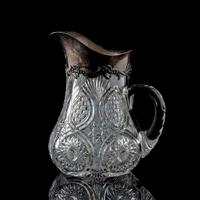 A Brilliant-Period Cut Glass Water Pitcher with Lilies of the Valley and a Silver Mount