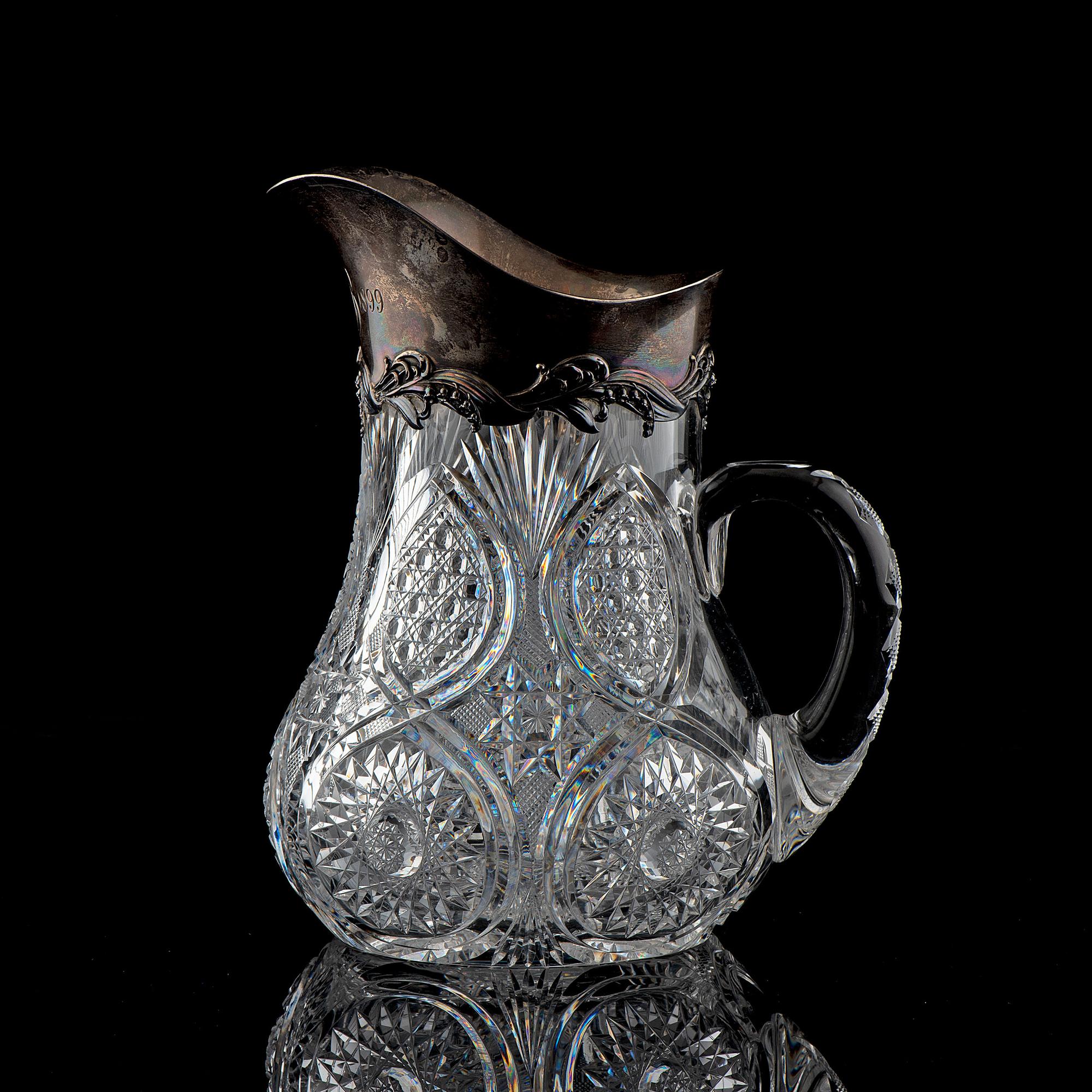 A Brilliant-Period Cut Glass Water Pitcher with Lilies of the Valley and a Silver Mount