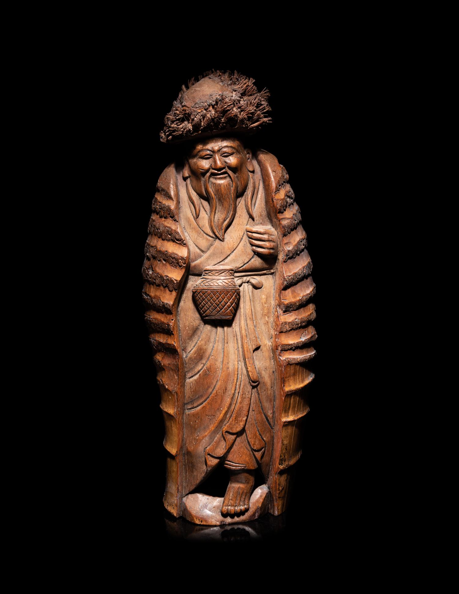 A Japanese Carved Bamboo Figure of an Elderly