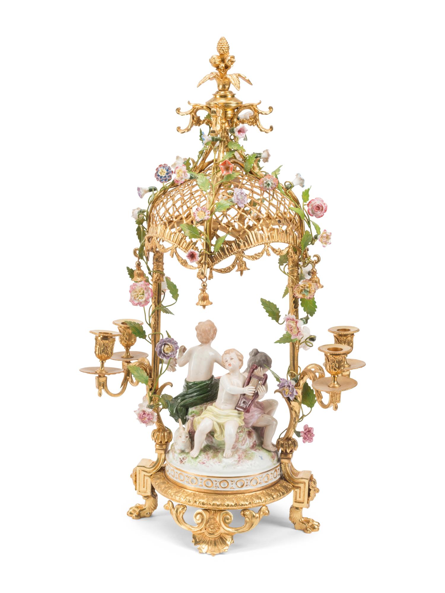 A Pair of French Gilt Bronze and Porcelain Figural Four-Light Candelabra