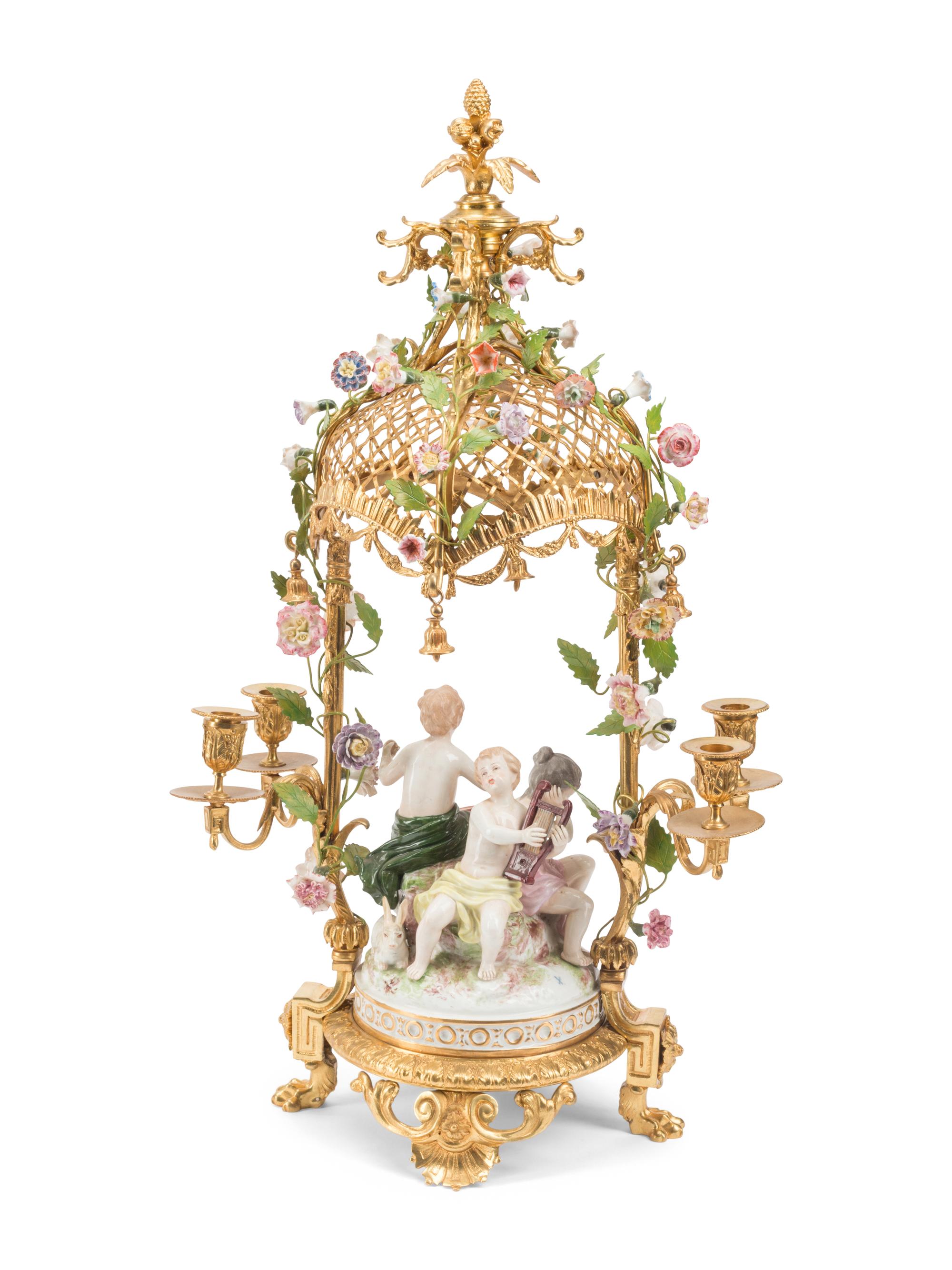 A Pair of French Gilt Bronze and Porcelain Figural Four-Light Candelabra