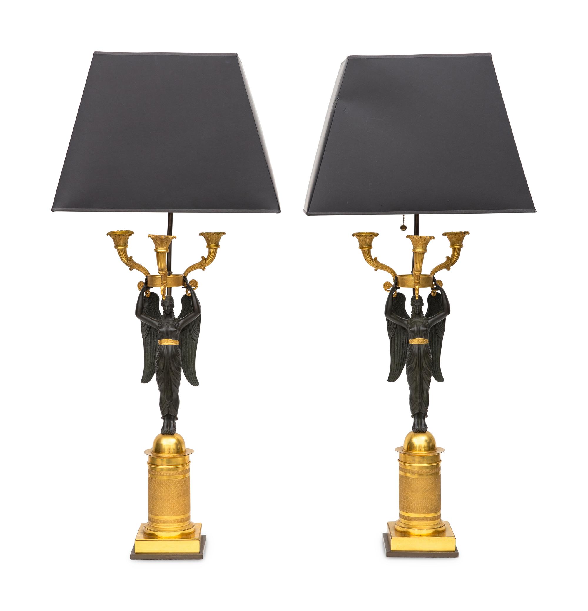 A Pair of Empire Style Gilt and Patinated Bronze Two-Light Figural Candelabra